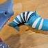 Hungry Hand Plays With Shark Fidget Toy