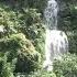 A Little Waterfall Making Its Way Down The Side Of A Mountain In The Bright Sun Helena Chevalier