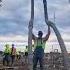 Concrete Worker Is Running Two Five Inch Drop Hoses At The Same Time