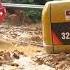 Oshkosh 8x8 And Cat Excavator Going Thru Heavy Mud