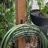 Build This Decorative Hose Holder From 4x4 Post Cost Of Hose Holder With Planter Diy Hose