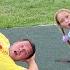 Sofia And Max Are Having Fun Playing On The Playground With Dad